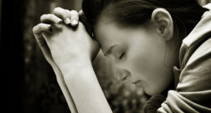 Young girl praying