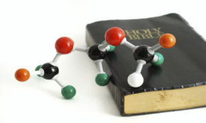 dna-strand-on-bible-600x360