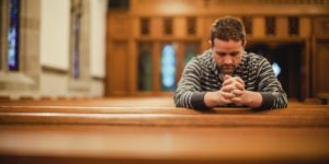 prayer-man-in-church-1200x600